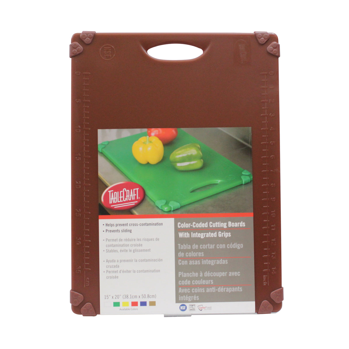 A packaged TableCraft grippy cutting board with brown edges, ruler markings, a top handle, and a front label showing color-coded boards with peppers. The label highlights features like integrated grips and non-slip corners.
