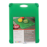 A green rectangular anti-slip cutting board with grippy corner grips. The packaging label shows a photo of the board with colorful peppers and provides product details in English, Spanish, and French. Dishwasher safe for easy cleaning.