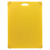 A rectangular yellow anti-slip cutting board with rounded corners and a handle cutout at the top. The board features rubber grips on each corner and faint measurement markings along the edges. The background is plain white.