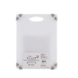 A white plastic Grippy Cutting Board with a built-in handle at the top and gray non-slip corner grips. An attached product label featuring images and text is visible near the bottom center. The background is plain white.
