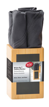 A TableCraft Products bamboo cutlery holder with four compartments holds rolled dark gray cloth napkins. Featuring a writable chalkboard for personalization, this Write-On Cutlery Holder sits on a white background.