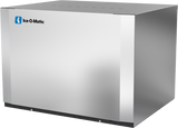 A stainless steel commercial ice maker with a smooth, reflective finish. The Ice-O-Matic logo is visible on the upper left corner. This modular cube ice maker sits on a black base and features vent holes on the top.
