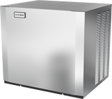 A large, rectangular, stainless steel Ice-O-Matic modular cube ice maker with a vented side panel and a branded label on the top left corner. The smooth, reflective surface features ventilation slits on the top and right sides.