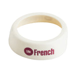 A white plastic Dispenser ID Collar with a wide, slanted edge. It features the words Lite French in bold, purple lettering—with Lite inside a solid purple circle. The inside of this TableCraft Products collar is a slightly darker off-white shade.