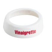 A white plastic TableCraft Dispenser ID Collar with "Vinaigrette" printed in bold red letters on the wide, flat outer surface. The ring features a hollow circular center and is set against a plain white background.