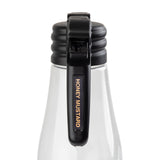 A clear, dishwasher safe bottle with a black flip-top lid, viewed from the front. The lid features a Name Tag label that reads “HONEY MUSTARD” in bold yellow letters on this simple glass or clear plastic container.