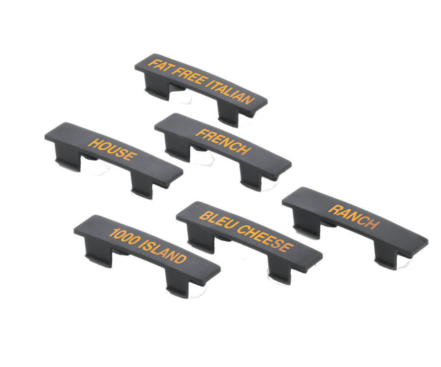 This TableCraft Products name tag set includes six black plastic condiment labels with orange text. Each dishwasher safe label—FAT FREE ITALIAN, HOUSE, FRENCH, BLEU CHEESE, 1000 ISLAND, and RANCH—has clips for easy container attachment.