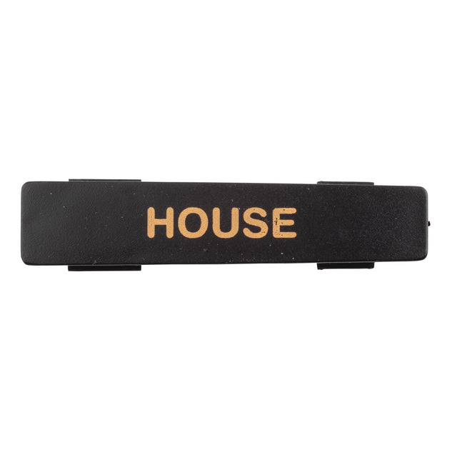 A rectangular black polypropylene name tag with the word HOUSE printed in gold, uppercase letters centered on it. The background is plain white, and the slightly textured nameplate is also dishwasher safe.