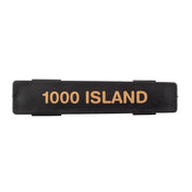 A rectangular black plastic Name Tag label with the words 1000 ISLAND printed in bold, gold-colored capital letters across the center. The flat, slightly glossy label is dishwasher safe and set against a plain white background.