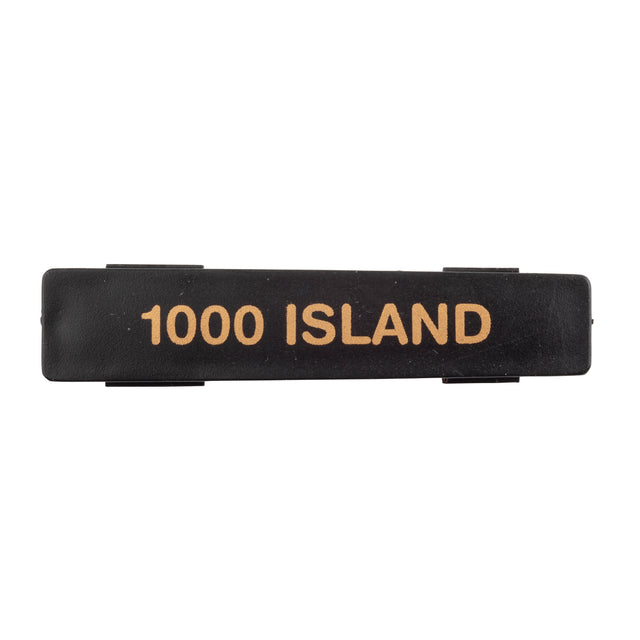 A rectangular black plastic Name Tag label with the words 1000 ISLAND printed in bold, gold-colored capital letters across the center. The flat, slightly glossy label is dishwasher safe and set against a plain white background.