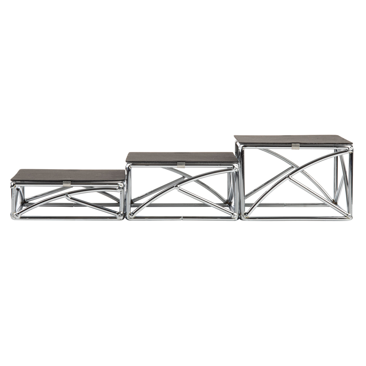 Three chrome plated metal step stools of varying heights are arranged in increasing order from left to right. Each features geometric cross-bracing beneath flat, rectangular black tops, giving a modern, industrial look—perfect as a stylish riser set.