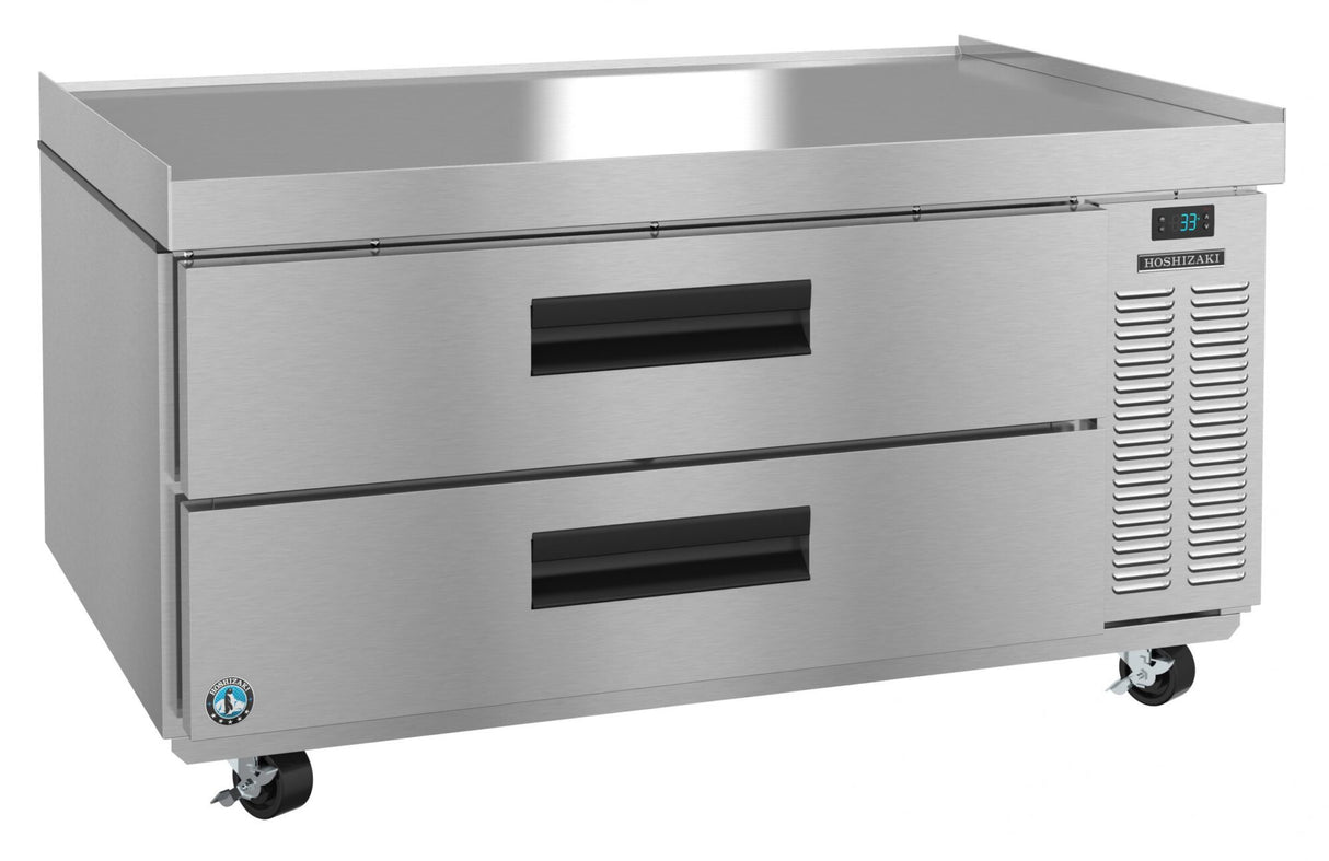 A stainless steel Steelheart Refrigerated Equipment Stand with two large pull-out drawers, right-side ventilation, digital temperature display, and four caster wheels for mobility. The Hoshizaki CR49A features a flat top and durable, industrial design.