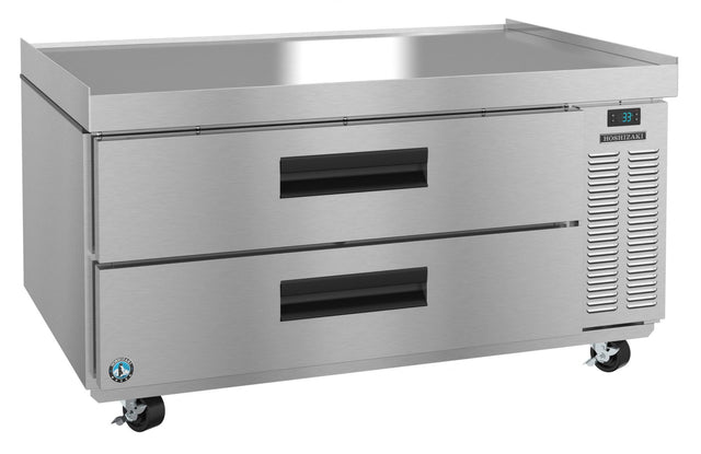 A stainless steel Steelheart Refrigerated Equipment Stand with two large pull-out drawers, right-side ventilation, digital temperature display, and four caster wheels for mobility. The Hoshizaki CR49A features a flat top and durable, industrial design.