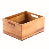 A rectangular acacia wood display crate with smooth, light brown sides, open top, and two oval cut-out handles. Visible wood grain and a slatted base evoke a stylish Gastro serving crate, shown on a white background.