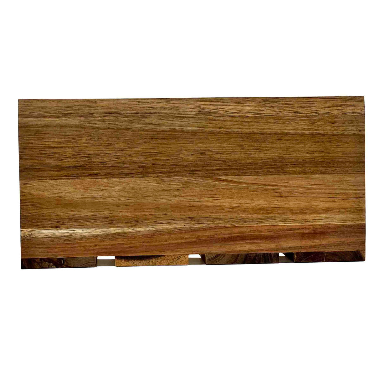 A rectangular wooden cutting board with a smooth finish and visible natural wood grain patterns in various shades of brown, reminiscent of an acacia wood crate. The board is positioned horizontally on a plain white background.