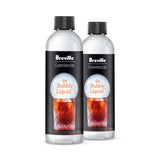 Two clear plastic bottles with black caps, labeled “Breville Commercial the Bubble Liquid,” stand side by side. Each label shows a glass with fizzy dark liquid and ice—perfect as a Smoke Bubble Liquid Refill for your Smoke Bubble Kit.