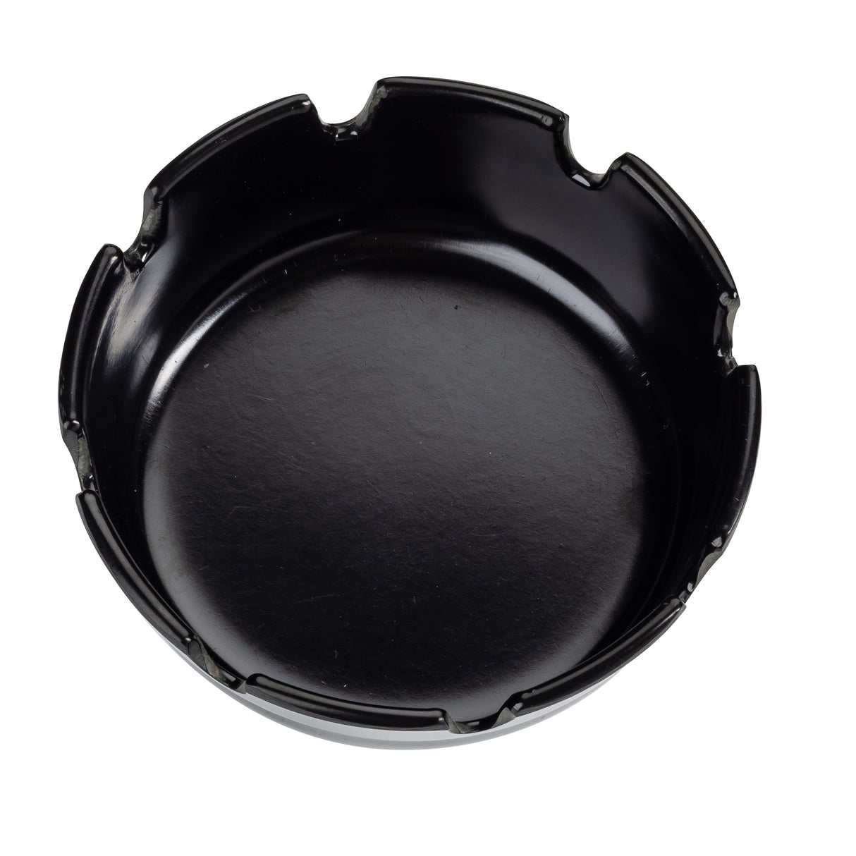 A round, black ceramic ashtray with a smooth surface and evenly spaced grooves for holding cigarettes is shown from above. Similar in style to economy ashtrays, it sits on a white background, making its features clearly visible.