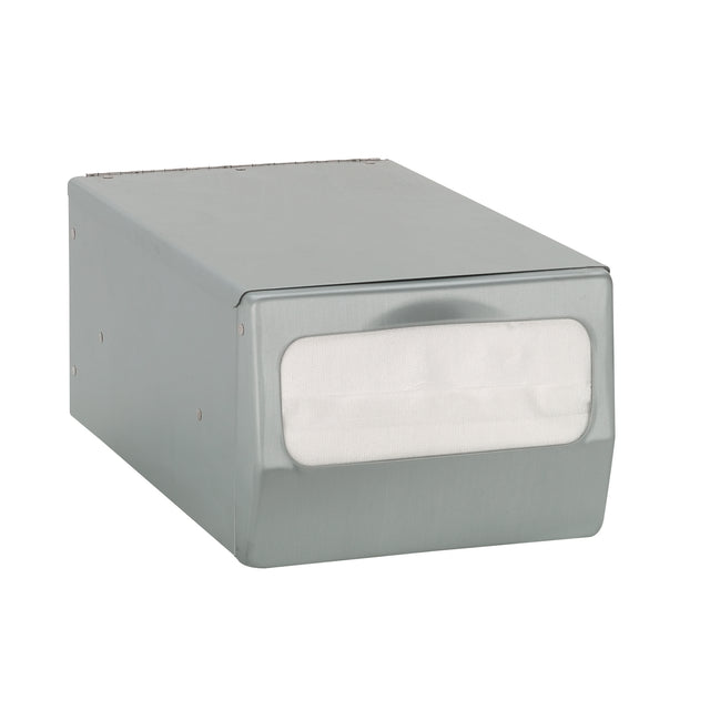 A rectangular stainless steel countertop napkin dispenser with a front opening displaying white full fold napkins. The smooth surface features rounded edges and a curved indentation for easy access. The dispenser sits on a plain white background.