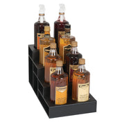 Eight assorted syrup bottles, arranged in two rows on a black polystyrene display stand. This countertop bottle organizer features three steps, holding each bottle securely with labels and pump dispensers, showcasing syrups from amber to dark brown.