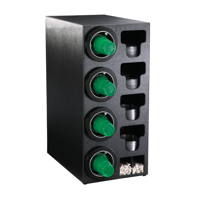 A black plastic NSF cup dispenser holds four green coffee cup lids, several stacks of small disposable cups, and a compartment with white stir sticks, organized vertically and horizontally. The unit is placed against a white background.