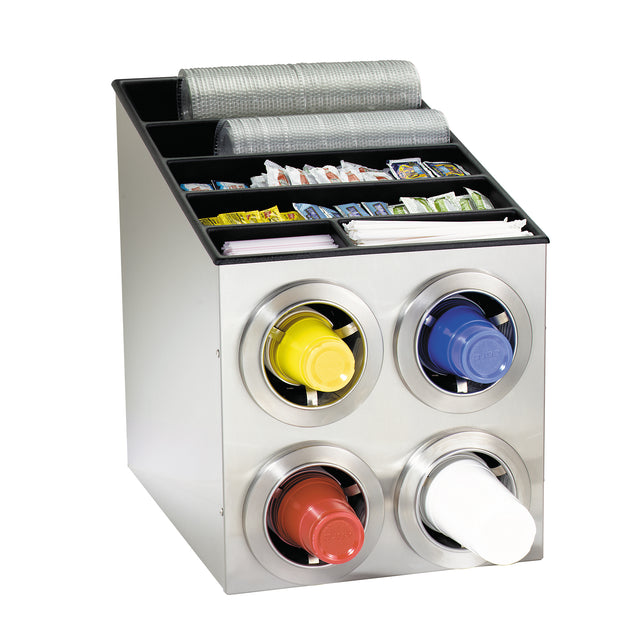 A stainless steel cup dispenser holds four stacks of cups in red, yellow, blue, and white. The top section features compartments with lids, straws, napkins, and assorted condiment packets, keeping everything neat and self-service ready.