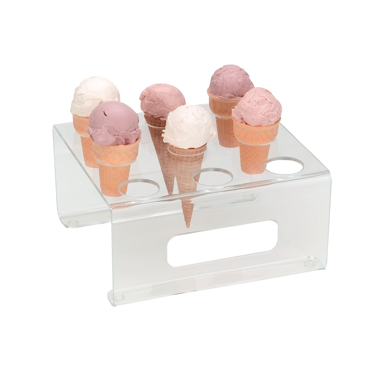 Six ice cream cones with pink and white scoops are displayed upright in an acrylic clear ice cream cone holder from Dispense-Rite, featuring six circular holes and a horizontal slot, on a white background.