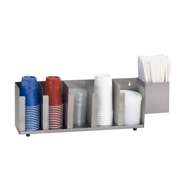 This sleek stainless steel Lid/Cup Organizer neatly holds four stacks of plastic cups—blue, red, clear, and white—with dividers. An adjustable container on the right stores white stir sticks for added convenience.