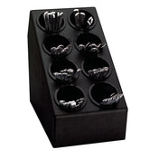 A black angled silverware organizer for your countertop, featuring eight round compartments, each holding shiny metal utensils like forks, knives, and spoons. The utensils stand upright in the circular slots against a plain white background.