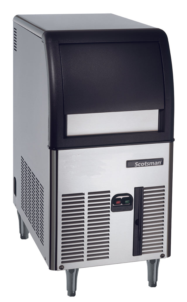 A stainless steel Scotsman undercounter ice maker with a black top, front door, and ventilation grilles. The unit stands on four metal legs and has a rectangular shape. The Scotsman logo is displayed on the front panel.