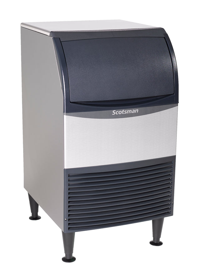A stainless steel undercounter ice maker with bin, featuring a dark top lid, front vent, and four black legs. Its modern rectangular design and visible Scotsman brand name stand out against the white background.