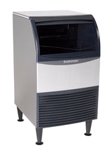 A freestanding, rectangular Scotsman Ice Maker with a black front panel, silver sides, and vented grill at the bottom. This ADA Compliant Ice Maker features a curved black lid on top and stands on four short legs.