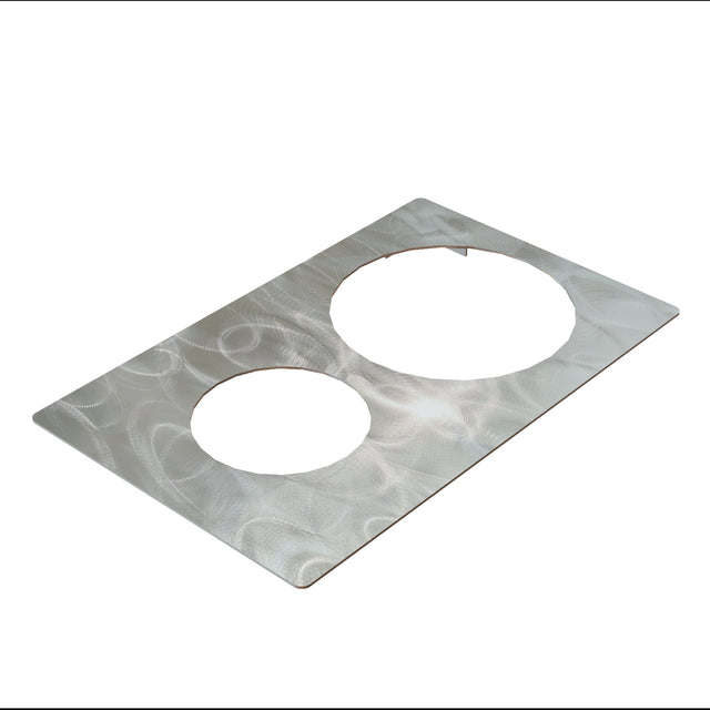 A rectangular sheet of brushed stainless steel with two large circular holes cut out side by side, likely a TableCraft Hot Food Template, rests on a white background. The metallic surface has a swirling texture and appears thin when viewed at an angle.