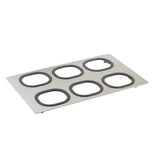 A rectangular stainless steel serveware tray with six evenly spaced, large oval cutouts lined with dark rubber gaskets; the flat, minimalist Tri-Ply Serveware Template is shown on a white background and is dishwasher safe.