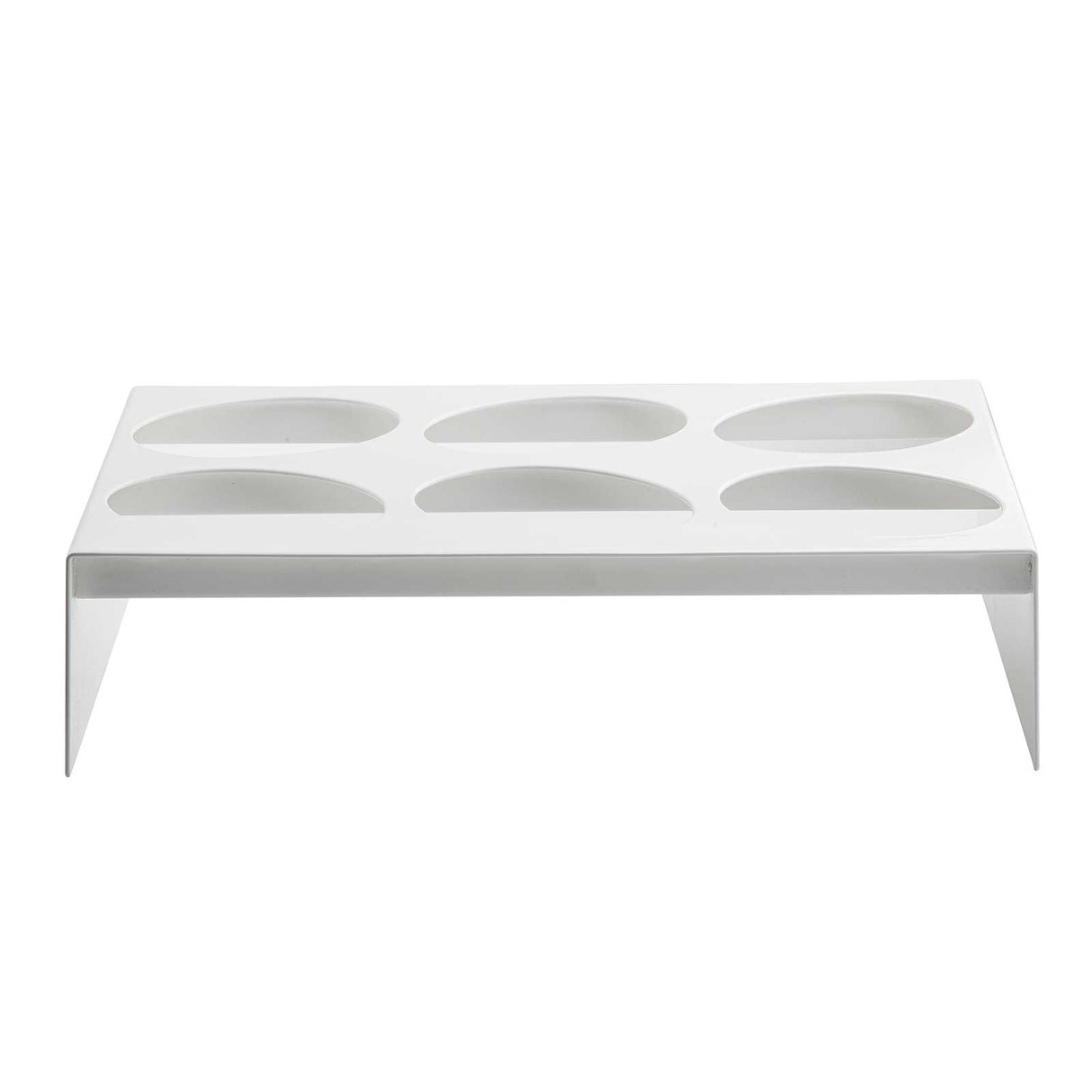 A rectangular, white TableCraft stand made from nylon coated cast aluminum with six oval-shaped depressions designed as a dressing template. Flat legs elevate it off the ground, creating a modern and minimalistic look.