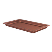 A rectangular, copper finish cast aluminum baking tray with slightly raised edges and a ridged surface, shown on a white background. The pan appears sturdy and suitable for roasting or baking food items.