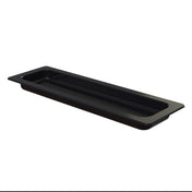 A rectangular, black cast aluminum tray with a shallow depth and grid-like pattern on the bottom, viewed from a slight angle. The tray has a wide rim and a small, raised compartment in one corner. The background is completely white.
