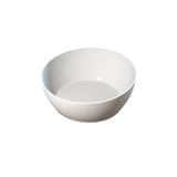 A plain, empty white ceramic Bowl is centered on a white background, casting a subtle shadow. The bowl’s smooth, curved sides and minimalist design make it ideal for cold holding or pairing with cast aluminum serveware.