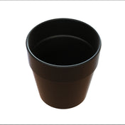 A black, empty, cylindrical cast aluminum plant pot with a slightly flared rim and a smooth matte finish is shown against a plain white background, viewed from above at an angle.