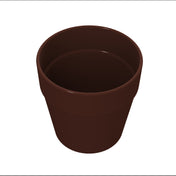 A plain, empty brown flowerpot is shown against a white background. Reminiscent of a cast aluminum condiment crock, the pot has smooth sides, a slightly wider rim at the top, and no markings or decorations. It’s viewed from above at a slight angle.