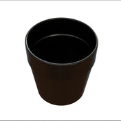 A black, empty, round plastic plant pot is shown from a slightly elevated angle against a white background. The pot has a flared rim and smooth surface, resembling a simple condiment crock with no visible labels or decorations.