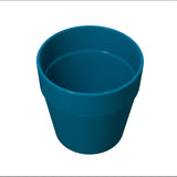 A plain, empty blue flower pot is shown against a white background. The surface is smooth and glossy, similar to a cast aluminum condiment crock, with a wide, rounded rim and no visible decorations or textures.