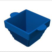 A blue, square-shaped cast aluminum container with ribbed sides and two rounded handles on opposite edges, viewed from above at an angle, set against a white background. The interior is smooth and the exterior sides are ridged vertically.