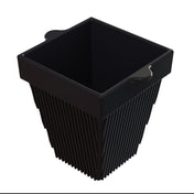 A black, square-shaped basket with vertical slats along its sides and two small side handles near the rim, shown on a white background. Crafted from cast aluminum, the basket features an open top and a modern, minimalistic design.