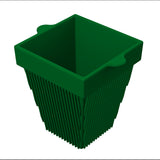 A green, square-shaped plant pot with slightly flared sides and vertical ridges resembles a stylish cast aluminum condiment bowl. The top edge features two rounded tabs, and the empty pot is shown against a white background.
