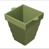 A green, square-shaped, plastic plant pot with two small protruding handles on opposite sides. The sides feature vertical ridges that expand outward toward the top, creating a flared shape. This plant pot is also dishwasher safe. Shown on a white background.