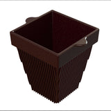 A dark brown, square-shaped cast aluminum planter with vertical ridges on the sides and two small handles on opposite edges of the rim, shown empty against a white background.