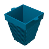 A blue, square silicone condiment bowl with ridged sides and two small handles on opposite edges near the top. The container is open at the top, tapers to a narrower base, and sits against a plain white background.