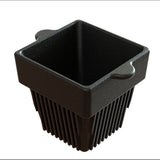 A black, square-shaped cast aluminum container with a speckled finish, featuring two small, curved handles and a base of long vertical slats, resembling a fry basket and ideal for cold holding condiments, photographed on a white background.