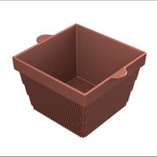 A brown, square silicone baking cup with ribbed sides and two small side handles. The inside is smooth, resembling a mini cold holding bowl, and the cup is empty, viewed from a slightly elevated angle against a white background.