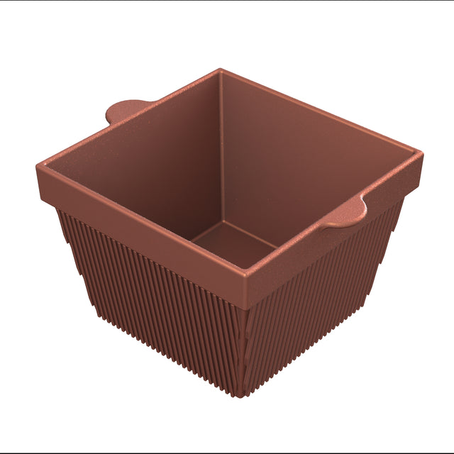 A brown, square silicone baking cup with ribbed sides and two small side handles. The inside is smooth, resembling a mini cold holding bowl, and the cup is empty, viewed from a slightly elevated angle against a white background.